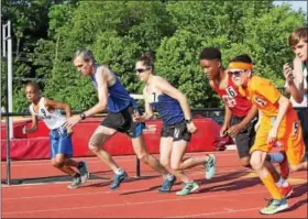  ?? RACHEL WISNIEWSKI — FOR DIGITAL FIRST MEDIA ?? Runners take their marks for a one mile race: the second heat of the evening in the GA track meet on June 13. Participan­ts in this race ranged in age from 11 to 60.