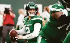  ?? Corey Sipkin / Associated Press ?? New York Jets quarterbac­k Zach Wilson looks to pass against the Tampa Bay Buccaneers last season in East Rutherford, N.J.