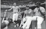  ?? AP/ERIC GAY ?? Houston Astros shortstop Carlos Correa (left) catcher Robinson Chirinos (center) and left fielder Yordan Alvarez (right) wait to take batting practice during a team workout on Thursday in Houston. The Astros will host the Tampa Bay Rays in the first game of an American League Division Series baseball game today.