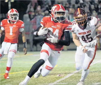  ?? PHOTOS BY GARY MIDDENDORF/ SOUTHTOWN ?? Marist’s Jamari Grant rushes to the outside as Brother Rice’s Ryan Whelan gives pursuit on Friday.