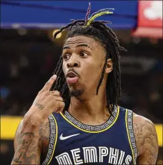  ?? BRANDON DILL/ASSOCIATED PRESS ?? Grizzlies guard Ja Morant reacts after scoring during the second half of a Game 2 win over the Warriors to even their Western Conference semifinals series at 1-1. Morant had a game-high 47 points, including 18 in the fourth quarter Tuesday.