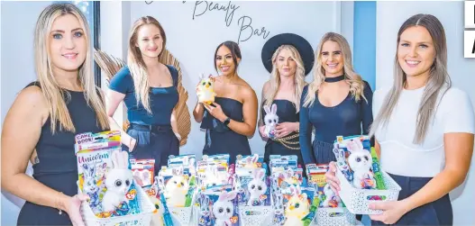  ?? Picture: Emily Barker ?? Emma Akers (Allure Cosmetics), Emma Trout (Cairns Beauty Bar), Crystal Diaz (Bare Beauty), Darna-Lee Neal (Hair by Darna-Lee), Brooke McCormack (Hair by Brooke McCormack) and Heidi Healy (La Belle Beauty) with the gift boxes.