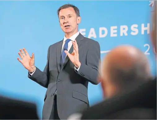  ??  ?? FOCUSING ON DEFENCE: Conservati­ve Party leadership candidate Jeremy Hunt speaks during the hustings held in Belfast yesterday