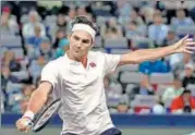  ?? AFP ?? Roger Federer hits a return against Russia’s Daniil Medvedev at the Shanghai Masters on Wednesday.