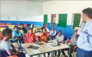  ?? PROVIDED TO CHINA DAILY ?? Students in Nigeria learn to use high-tech education products donated by Elernity, an education subsidiary of NetDragon Websoft Inc.