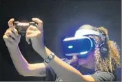  ?? Christina House
For The Times ?? SIANNA HASENBERG tries out Sony’s Project Morpheus at E3. Virtual reality headsets aren’t light.