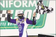  ?? Gerry Broome / Associated Press ?? Chase Elliott celebrates after winning a NASCAR Cup Series auto race at Charlotte Motor Speedway on Thursday in Concord, N.C.