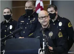  ?? LYNDA M. GONZÁLEZ — THE DALLAS MORNING NEWS ?? Chief Eddie Garcia, center, speaks during a press conference at the Dallas Police Department headquarte­rs on Thursday regarding the arrest and capital murder charges against Officer Bryan Riser.