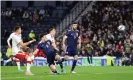  ?? Kieran Tierney heads Scotland’s goal. Photograph: Steve Welsh/PA ??