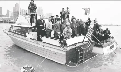  ??  ?? Autoworker­s on boats from both sides of the border, including members of the United Auto Workers’ Downriver Anti-pollution League, hold a wake on the Detroit River on the first Earth Day on April 22, 1970. WALTER P. REUTHER LIBRARY, WAYNE STATE UNIVERSITY