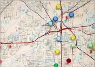  ?? AP PHOTO BY LM OTERO ?? In this May 24, photo, colored pins on a map marks churches in areas of Fort Worth where research is predicting that there’s a high risk of child abuse and neglect occurring.