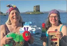  ??  ?? Charity swimmers Anna Northover and Annie Anderson getting in deep to help raise funds for Oban Toy Cupboard