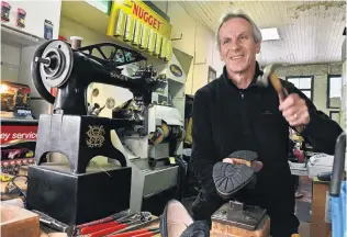  ?? PHOTO: CHRISTINE O’CONNOR ?? Service with a smile . . . Paul Ayers repairs footwear in his Stuart St premises before making home deliveries to customers.