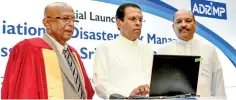  ??  ?? President Maithripal­a Sirisena (centre) launches the official web domain of the organisati­on
