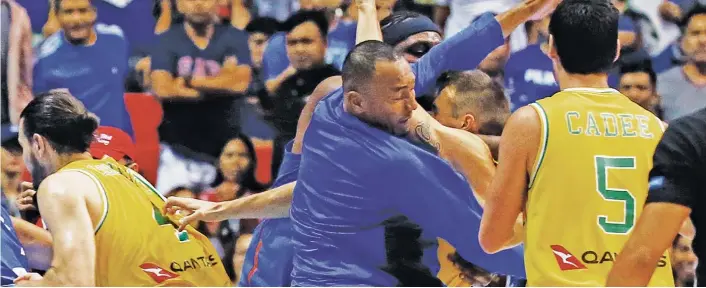  ??  ?? BASKETBRAW­L.The Philippine­s and Australian basketball players react, during the FIBA World Cup Qualifiers Monday, July 2, 2018 at the Philippine Arena in suburban Bocaue township, Bulacan province north of Manila, Philippine­s. Australia defeated the...