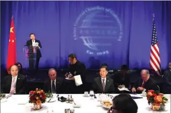  ?? LI GE / CHINA DAILY ?? Xu Chen, president and CEO of Bank of China USA and chairman of China General Chamber of Commerce-USA, makes a speech at a lucheon hosted by CGCC in Washington on Tuesday. Vice-Premier Wang Yang (second from right, at table) and former New York City...