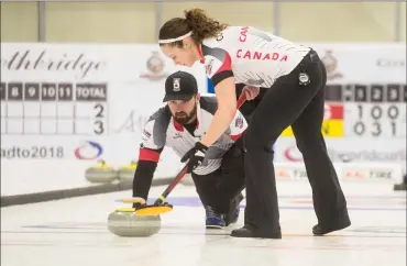  ?? Herald photo by Tijana Martin @TMartinHer­ald ?? Joanne Courtney and Reid Carruthers of Canada beat England 7-6 during a qualifying game at the World Mixed Doubles Curling Championsh­ips at the ATB Centre on Wednesday.