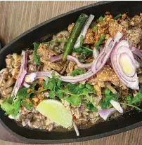  ?? JP and Camille Anglo ?? Sisig three-ways at Kooya Filipino Eatery