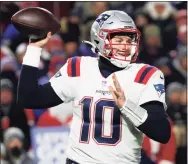  ?? Jeffrey T. Barnes / Associated Press ?? New England Patriots quarterbac­k Mac Jones looks to make a pass during the second half against the Buffalo Bills on Monday.