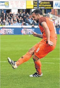  ??  ?? Scott McDonald helps Dundee United to a bonus point by converting his penalty kick in the shoot-out.