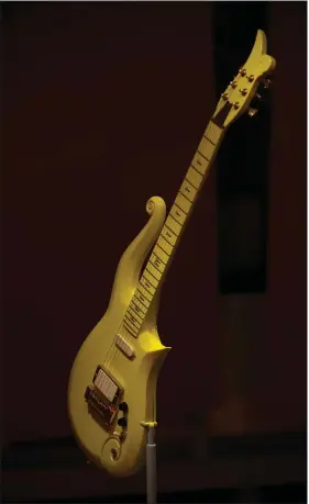  ?? PHOTOS BY ASTRID RIECKEN — FOR THE WASHINGTON POST ?? Pictured is the late Prince’s iconic “Yellow Cloud” guitar.