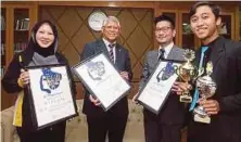  ??  ?? (From left) Ramona, Hassan, Kishimoto and Amirul with the award and trophies the UiTM Chamber Choir had
won at Praga Cantat in October.