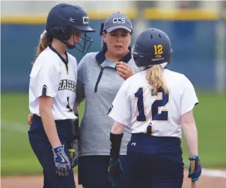  ?? STAFF PHOTO BY ANGELA LEWIS FOSTER ?? Chattanoog­a Christian coach Lisa Gray, talking with Madison Vandergrif­f, left, and Anslee Walker, has turned a softball program that was dormant two years ago into the 2017 District 7-AA regular-season champion.