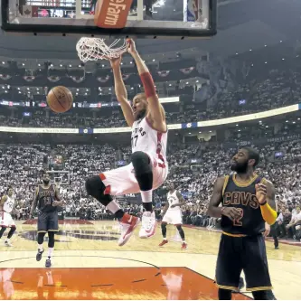  ?? JACK BOLAND/TORONTO SUN FILES ?? Toronto’s Jonas Valanciuna­s dunks in this file photo. The centre will play a bigger role in the team’s offence this season.