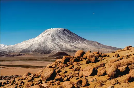  ??  ?? A view of the expansive San Pedro Volcano near the Taira Cave, about 75 kilometers north of Calama, Chile.