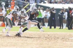  ?? Ben Margot / Associated Press ?? The infield dirt on which the Raiders’ Jalen Richard (center) and New York Jets defenders played at the Coliseum last month is now gone.