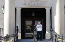  ?? MATT STONE — BOSTON HERALD ?? A court officer guards the front of Norfolk Superior Court for the first day of jury selection and the first day of the 200-foot buffer zone to distance demonstrat­ors from potential jurors.