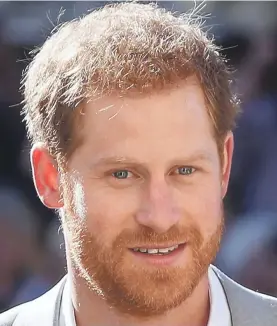  ?? DANIEL LEAL-OLIVAS/POOL ?? Prince Harry’s distinctiv­e red hair and blue eyes are among the many reasons his fans say they adore him.