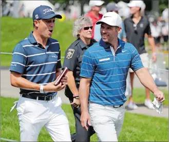  ?? NAM Y. HUH/AP PHOTO ?? Justin Thomas, left, walks with Paul Casey during the first round of the BMW Championsh­ip on Aug. 15 at Medinah Country Club in Medinah, Ill.