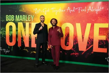  ?? CHRIS PIZZELLO-ASSOCIATED PRESS ?? Kingsley Ben-Adir, left, the star of “Bob Marley: One Love,” poses with Marley’s son Ziggy at the premiere of the film, on Feb. 6 in Los Angeles.