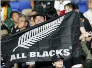  ?? SHUJI KAJIYAMA — THE ASSOCIATED PRESS ?? A New Zealand fan holds an All Blacks flag on Sept. 21, 2019.