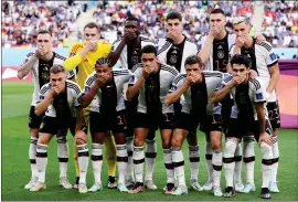  ?? ?? The Germany squad cover their mouths in protest at Qatar 2022