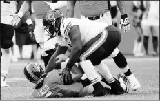  ?? JOSE M. OSORIO CHICAGO TRIBUNE ?? Bears nose tackle Eddie Goldman is called for roughing the passer for a hit on Broncos quarterbac­k Joe Flacco early in the fourth quarter last Sunday in Denver.