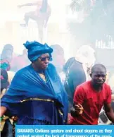  ??  ?? BAMAKO: Civilians gesture and shout slogans as they protest against the lack of transparen­cy of the presidenti­al election’s campaign on Saturday.— AFP