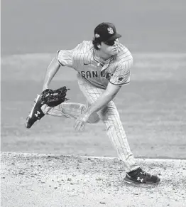  ?? K.C. ALFRED U-T ?? Padres left-hander Ryan Weathers pitches in the third inning Tuesday against the Dodgers in Game 1 of the NLDS at Globe Life Field in Arlington, Texas.