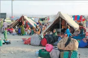  ?? PHOTO BY AGENCE FRANCE-PRESSE ?? Afghan refugees rest at a makeshift camp on Tuesday in Chaman, a Pakistani town on the border with Afghanista­n, amid the fallout of the US troop withdrawal.