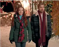  ?? ?? Lohan and Chord Overstreet in Falling for Christmas.