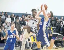  ?? BOB TYMCZYSZYN/STANDARD STAFF ?? Jean Vanier's Phil Angervil (3) defends against Port Colborne Bears #30 during the Tribune basketball tournament Thursday.