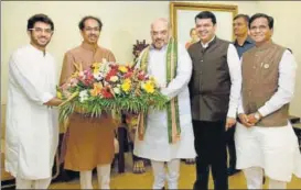  ?? PTI ?? (From left) Aditya Thackeray and Shiv Sena president Uddhav Thackeray, BJP president Amit Shah, Maharashtr­a CM Devendra Fadnavis, and state BJP chief Raosaheb Danve in Mumbai on Sunday.