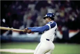  ?? MANNY RUBIO/US PRESSWIRE ?? Atlanta Braves outfielder Hank Aaron hits his 715th career home run off Los Angeles Dodgers pitcher Al Downing on April 8, 1974, breaking the all-time career home run record previously held by Babe Ruth.