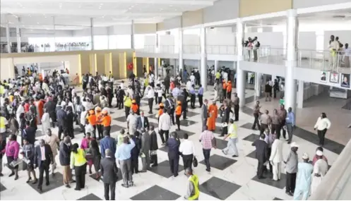  ?? ?? Passengers at Abuja Airport