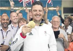  ??  ?? Golfer Justin Rose, who has been credited with also inspiring Team GB, with his gold medal at Heathrow.