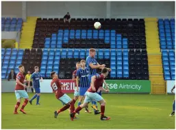  ?? RAY RYAN ?? Daniel McDonnell at the Athlone Town stadium while the Cobh Ramblers and Athlone Town players compete in front of a sparse crowd