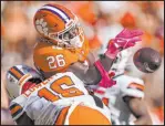  ?? Jacob Kupferman The Associated Press ?? Syracuse linebacker Leon Lowery thwarts a pass to Clemson running back Phil Mafah in the second half of the Tigers’ 27-21 win Saturday.