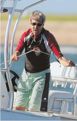  ?? STAFF FILE PHOTOS BY FAITH NINIVAGGI ?? ACK-ING IT IN: John Kerry’s days of frolicking in the waters around Brant Point have drawn to a close as the former Secretary of State shifts his ‘summering’ from Nantucket to Chilmark.