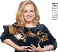  ?? Photo: REUTERS ?? The Times Big haul: Singer Adele holds her six Grammy Awards at the 54th annual Grammy Awards in Los Angeles. She won in every category she was nominated, including album of the year for